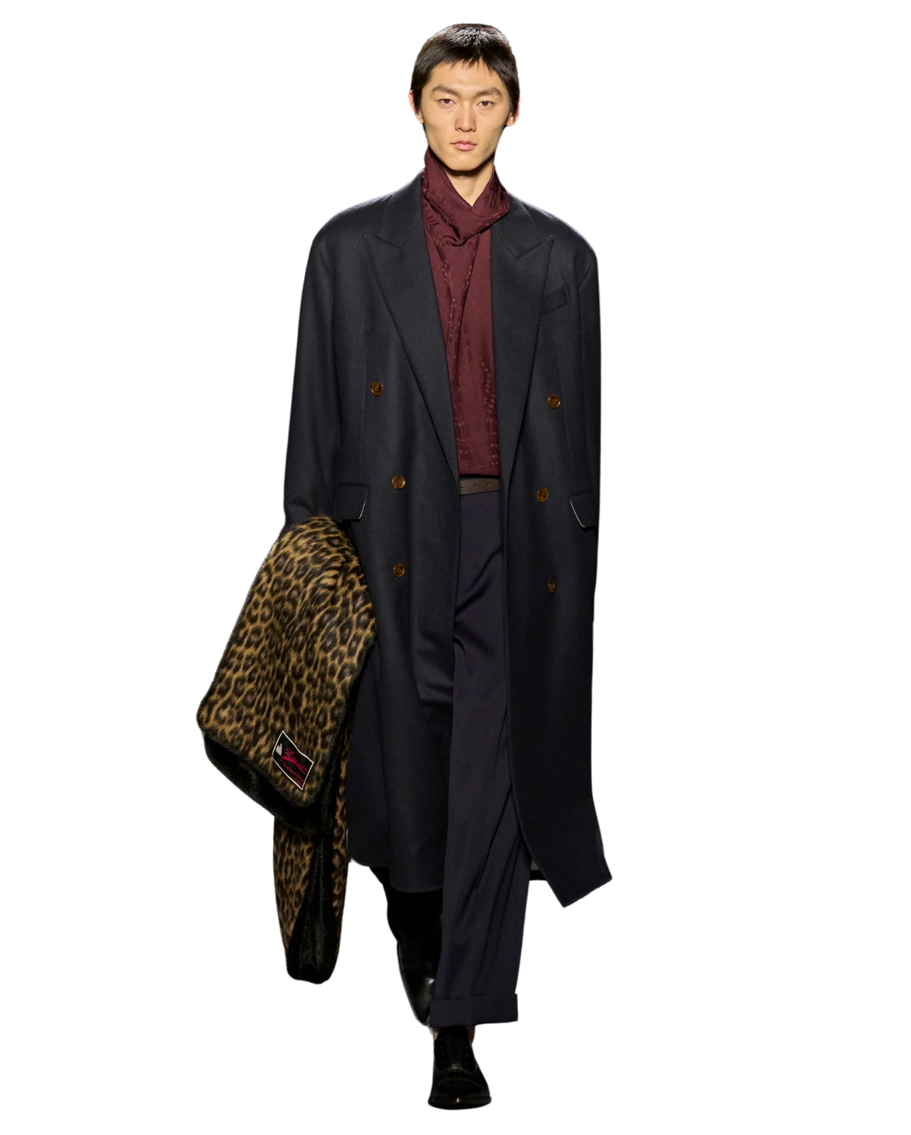 Lanvin Model on runway wearing Navy coat and pants with burgundy shirt holding a cheetah print scarf