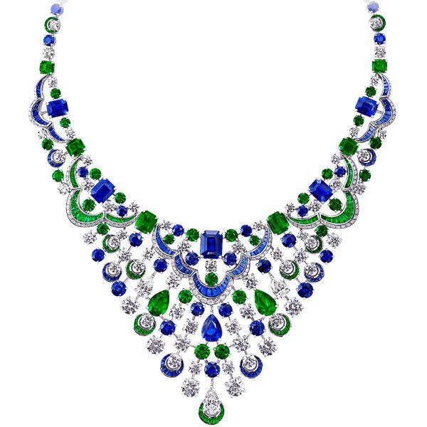 An extraordinary Graff masterpiece comprising a scintillating web of white diamonds weighing 35.12 carats, vibrant emeralds weighing 28.50 carats and 47.57 carats of richly hued blue sapphires.