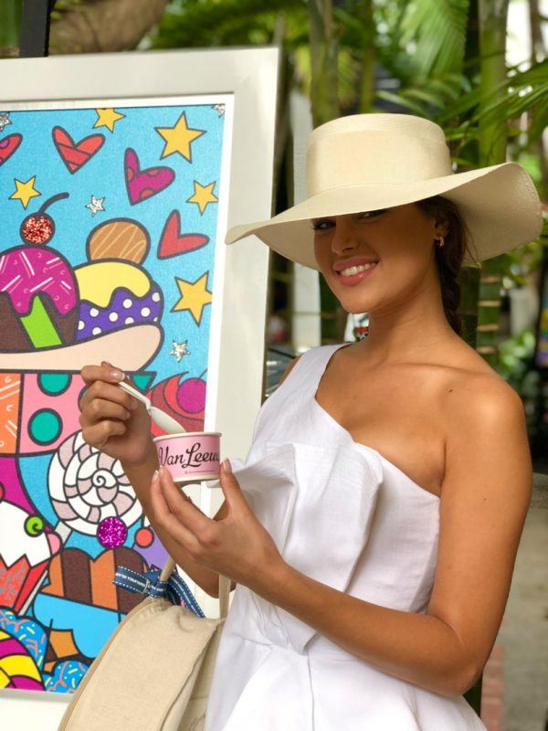 100% Capri model enjoying Van Leeuwen Ice Cream in front of the Britto Pop-Up for ICE CREAM WE LOVE 2020