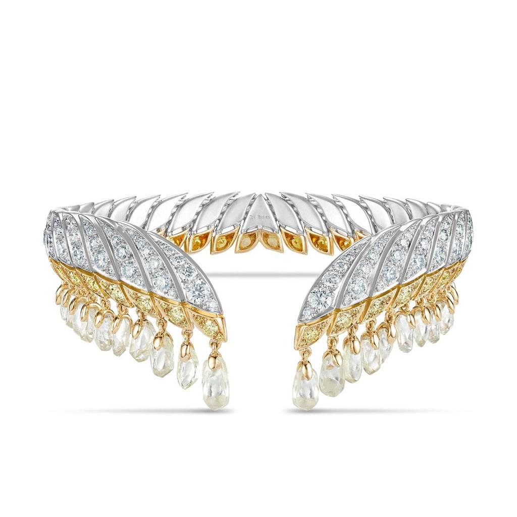 Brilliant and yellow diamond cuff with suspended white raw diamonds