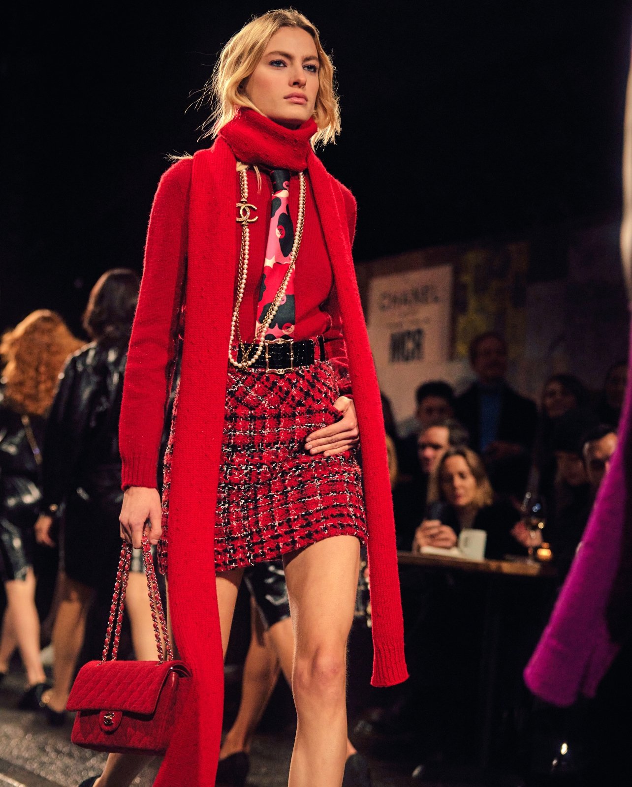 Model wearing a red twead look from the Chanel’s 2023/24 Métiers d’art collection show.