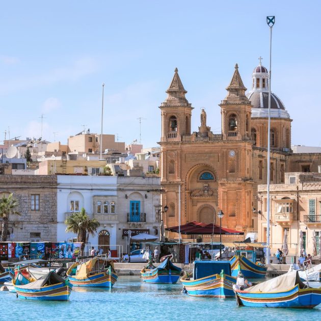Traditional colorful boats in the harbour of Valletta City