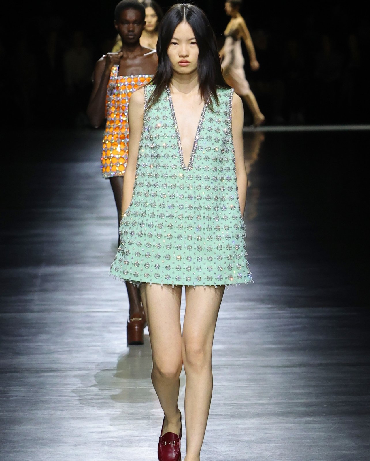 Female Model wearing a blue crystal embellished dress from Gucci’s spring/summer 24 collection runway show