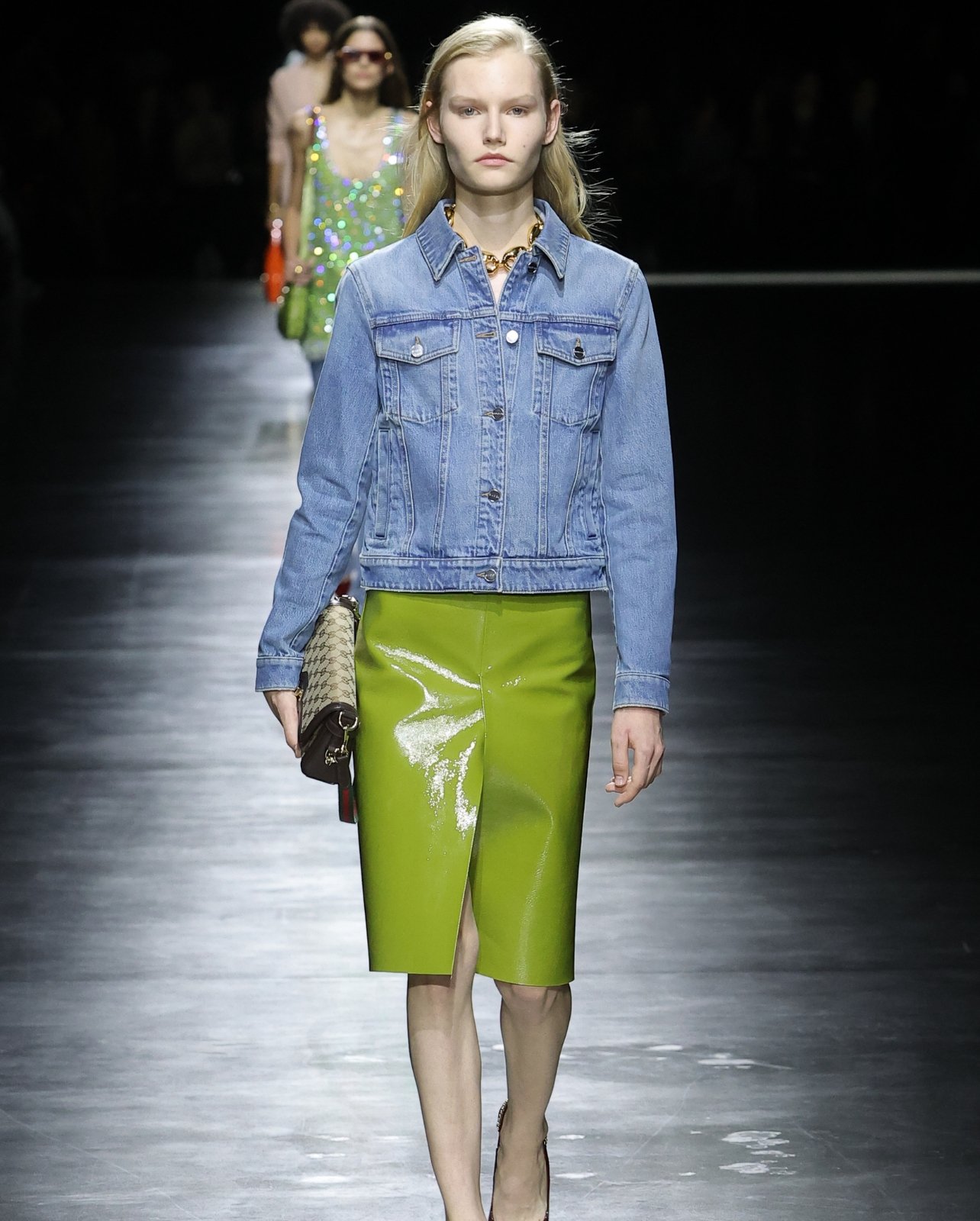 Female Model wearing a denim jacket with green skirt from Gucci’s spring/summer 24 collection runway show