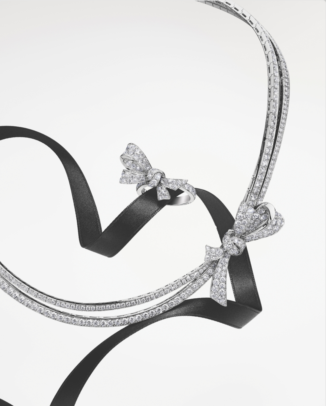 Graff tilda’s bow collection ring and necklace wrapped on black ribbon