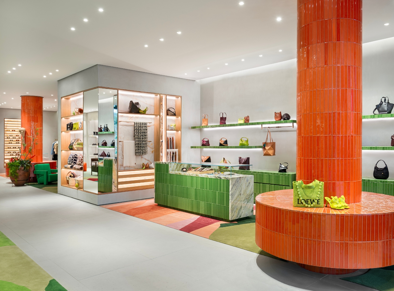 Interior of Loewe’s new Bal Harbour Shops boutique with orange and green structural accents