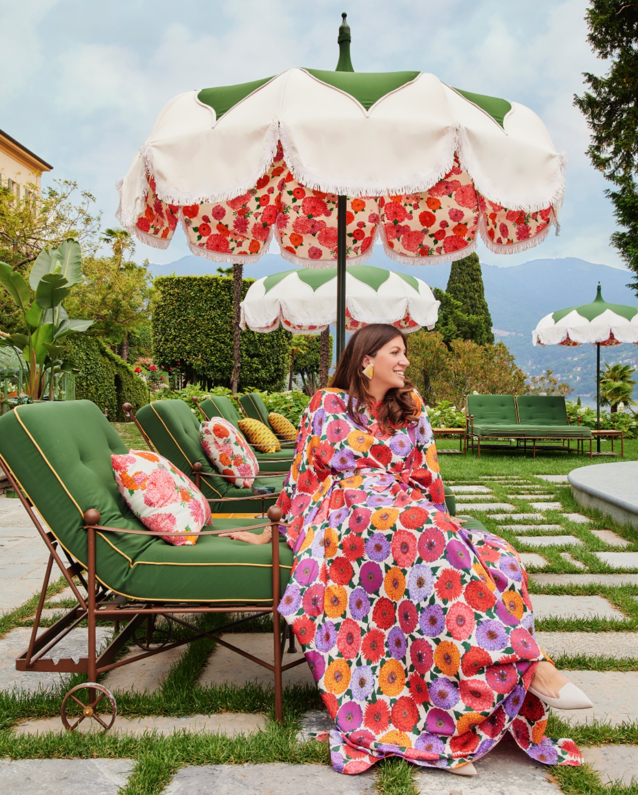 Portrait of Valentina de Santis sitting by pool in colorful outfit