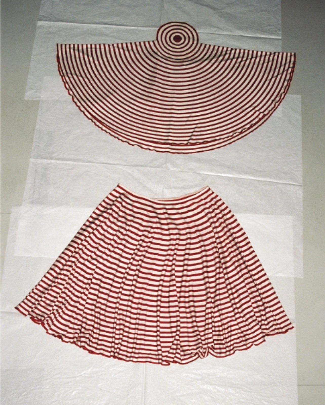 Martin Margiela red and white striped top and skirt laying on tissue paper