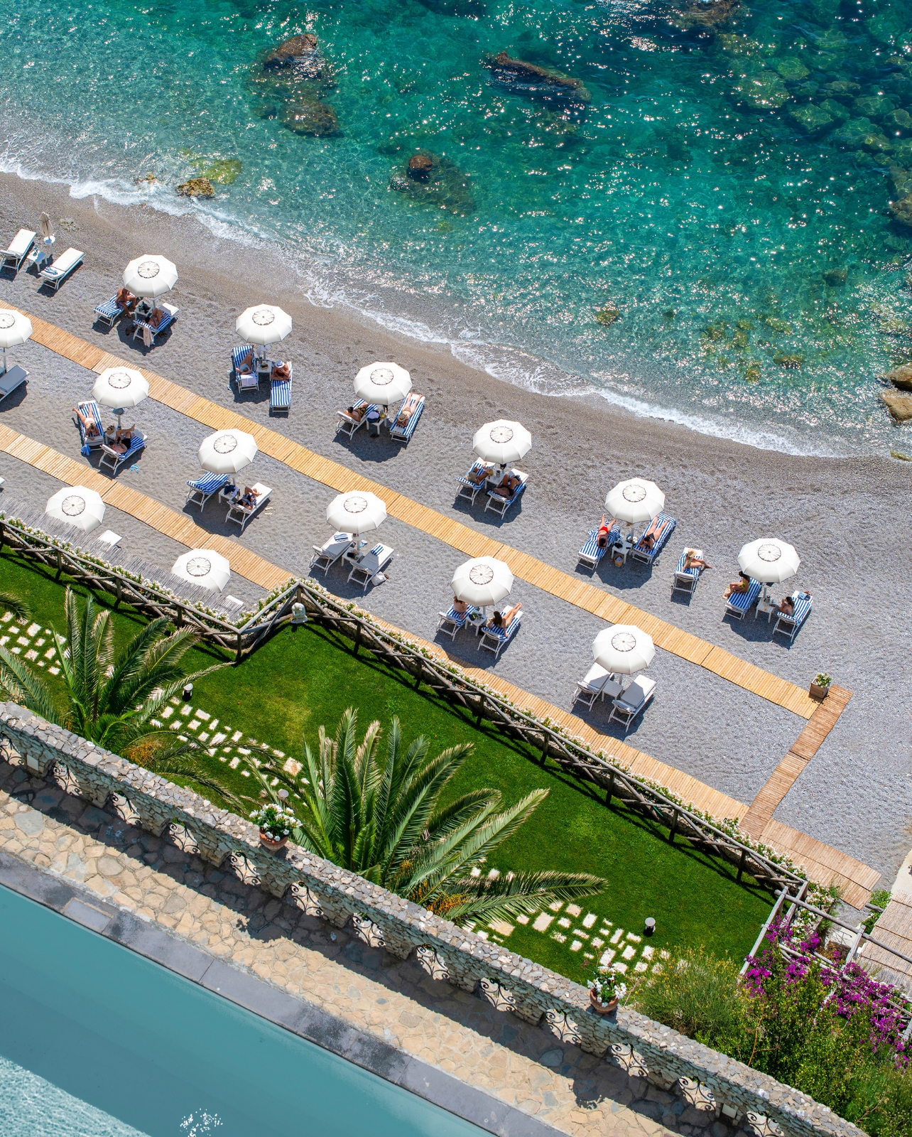 Aerial view of the Borgo Santandrea beach area with beach chairs and umbrellas