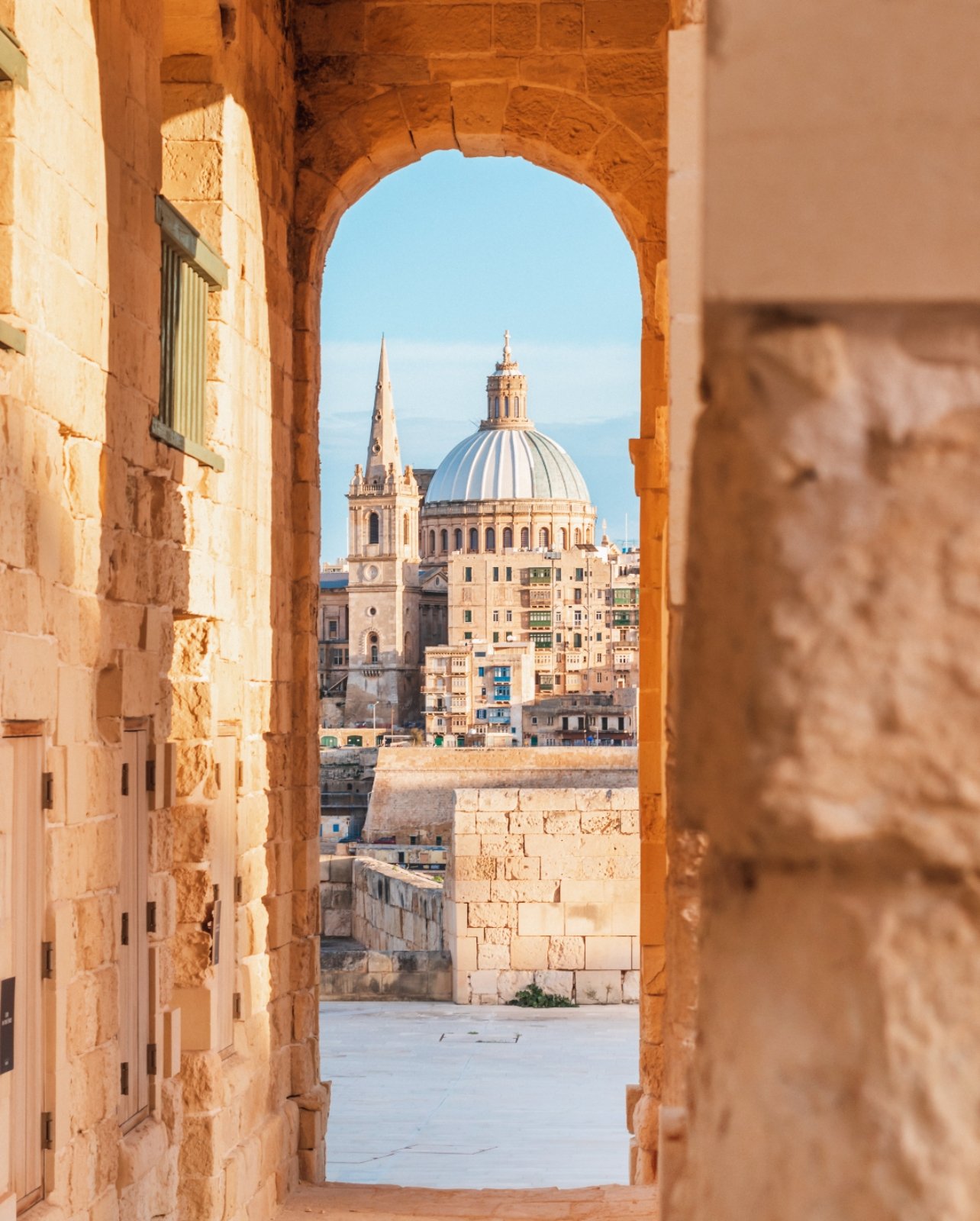 The Basilica of Our Lady of Mount Carmel through an ancient archway