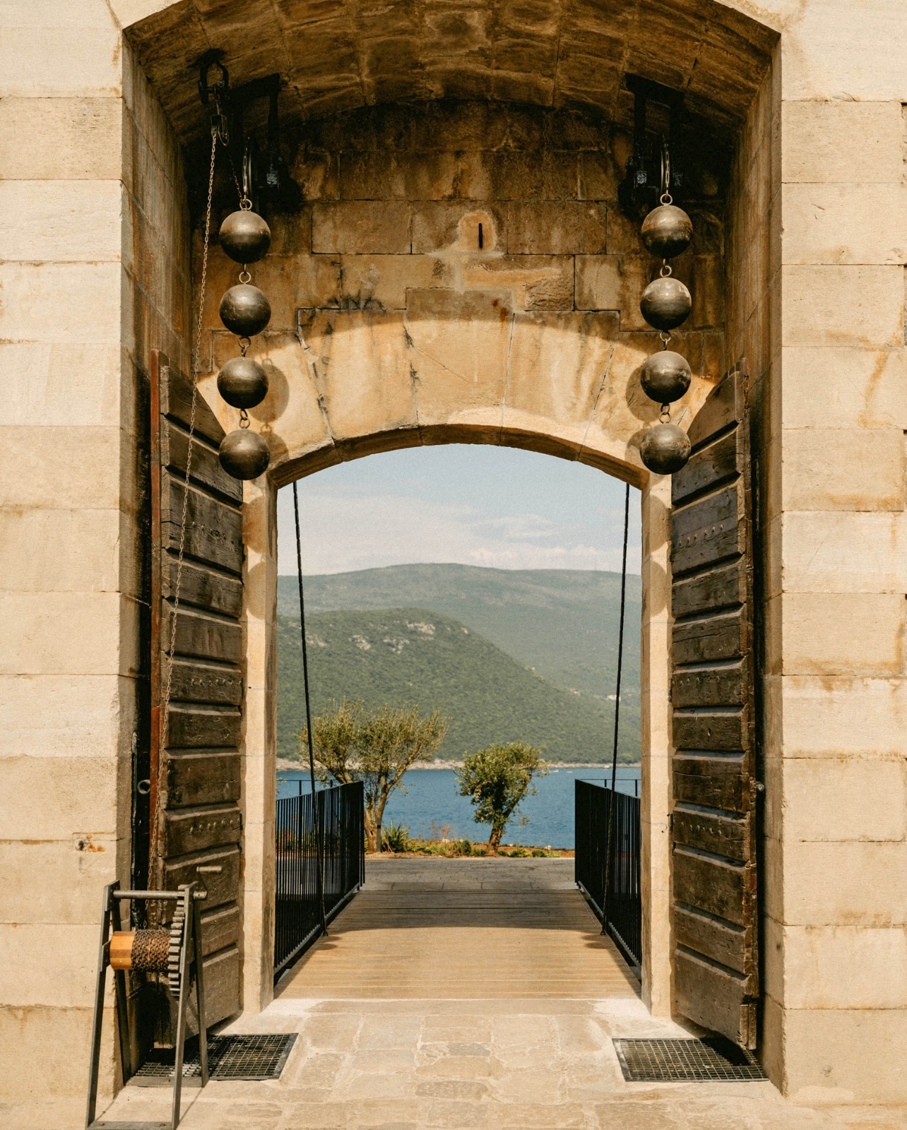 Archway with a view of Mamula Island through the center