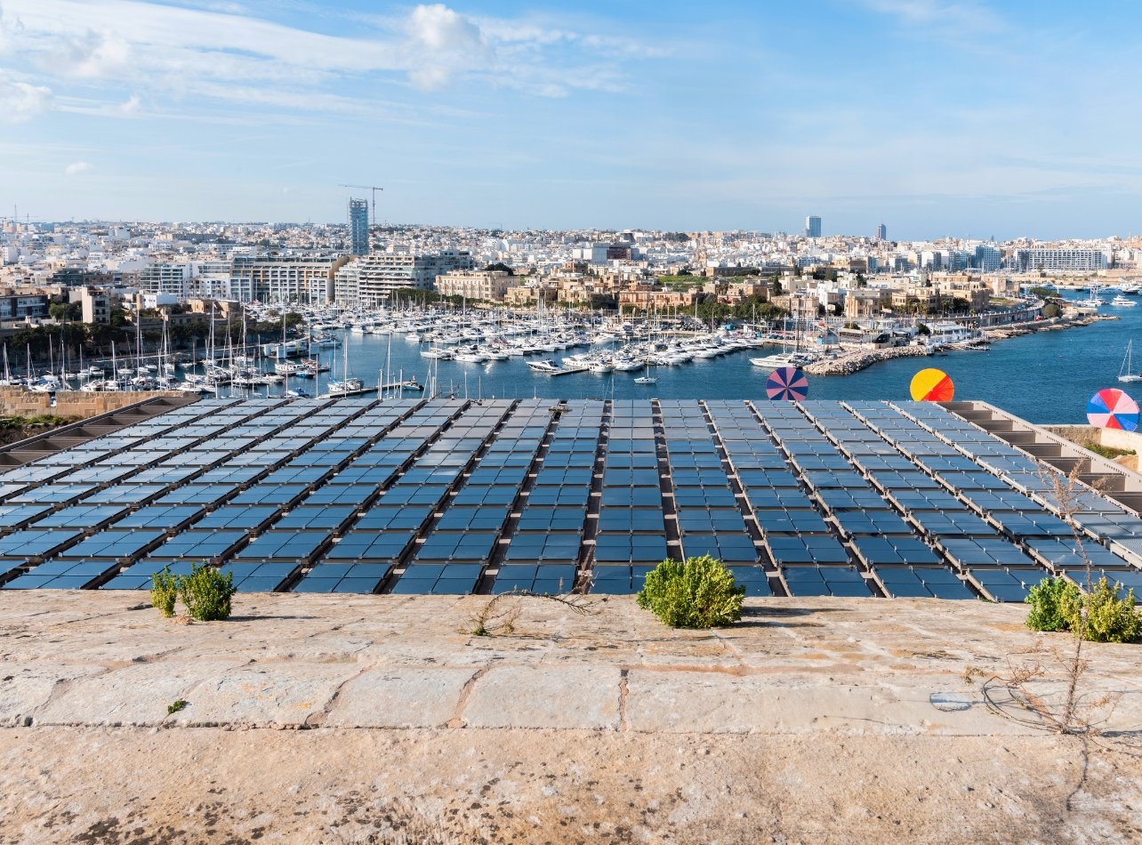 Solar panels on MICAS with waterfront view and marina