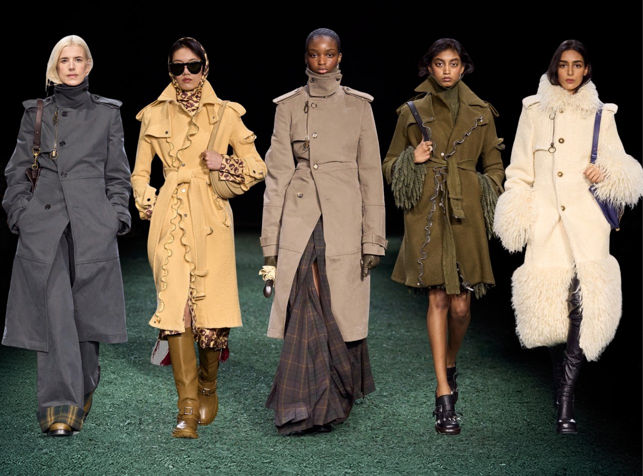 Burberry models walking on green runway in various trench coat iterations