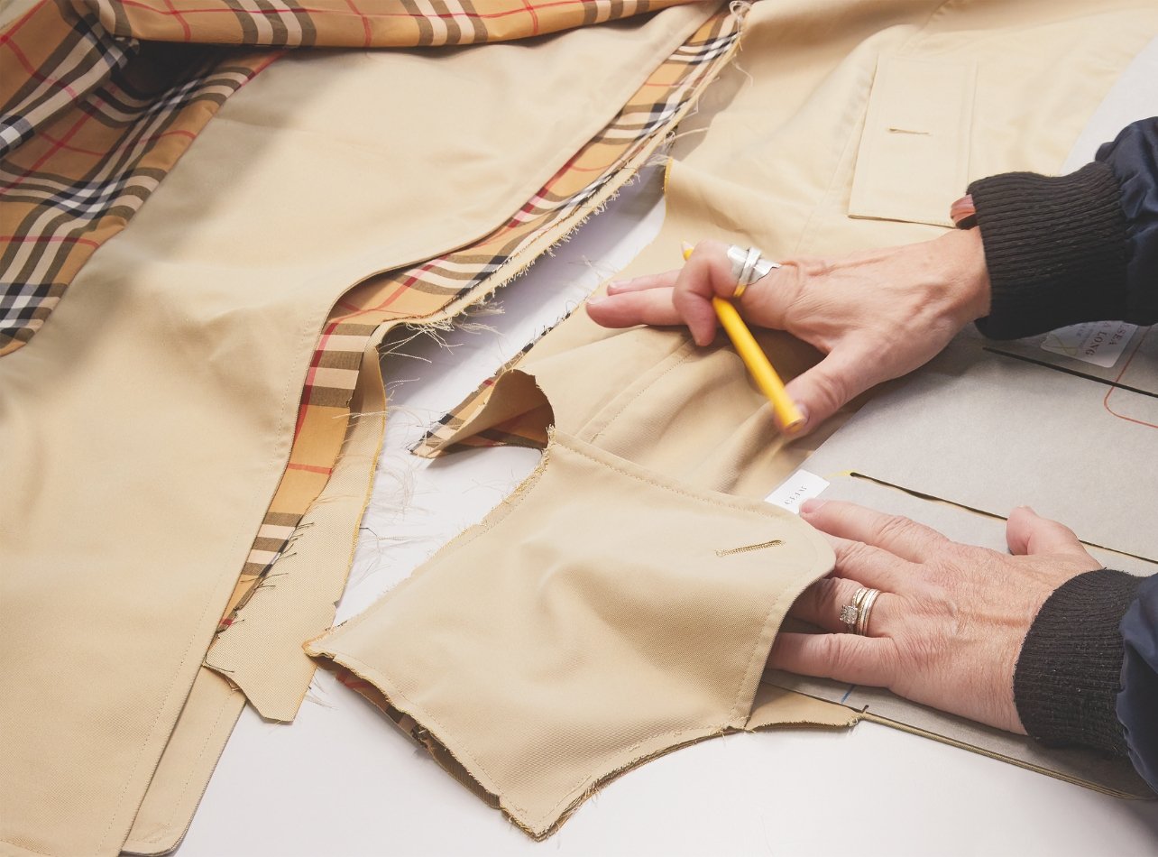 Burberry seamstress measuring fabric