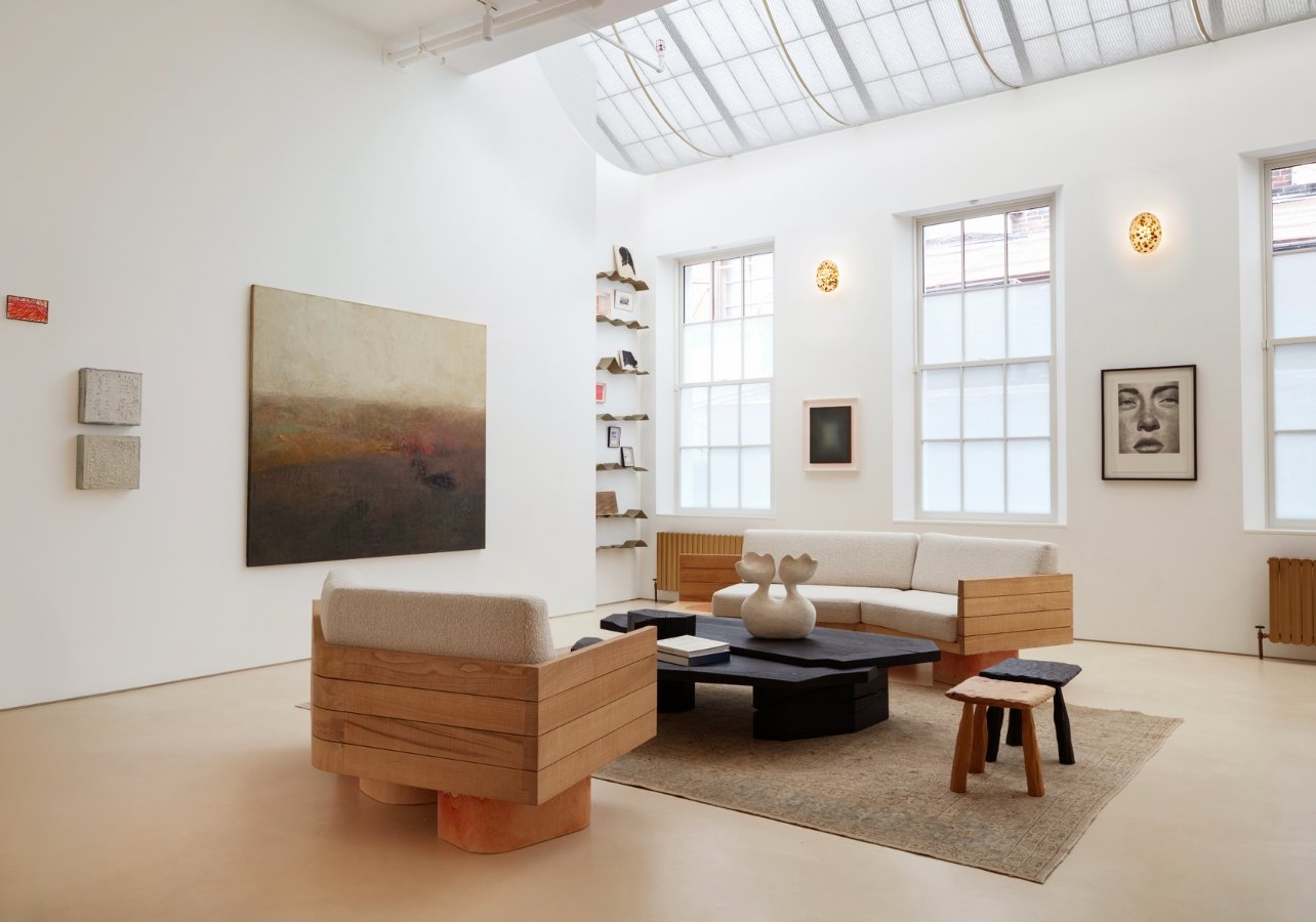 Living room with wooden furtinure and a painting hanging on left wall