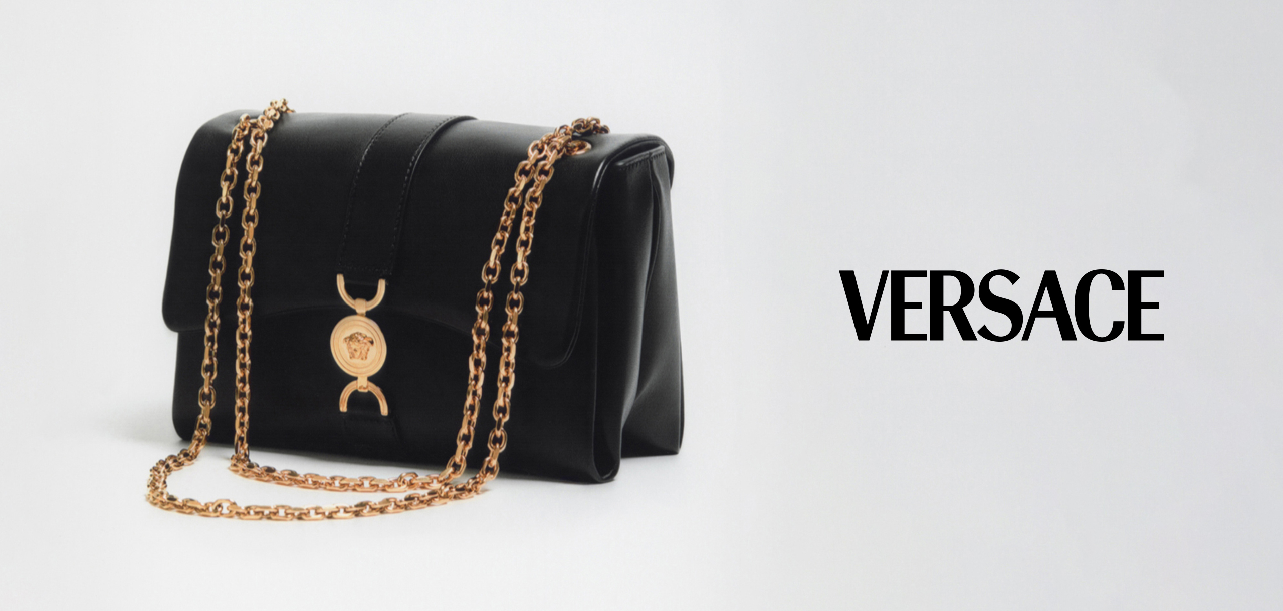 Versace black bag with gold chain detailing and Logo