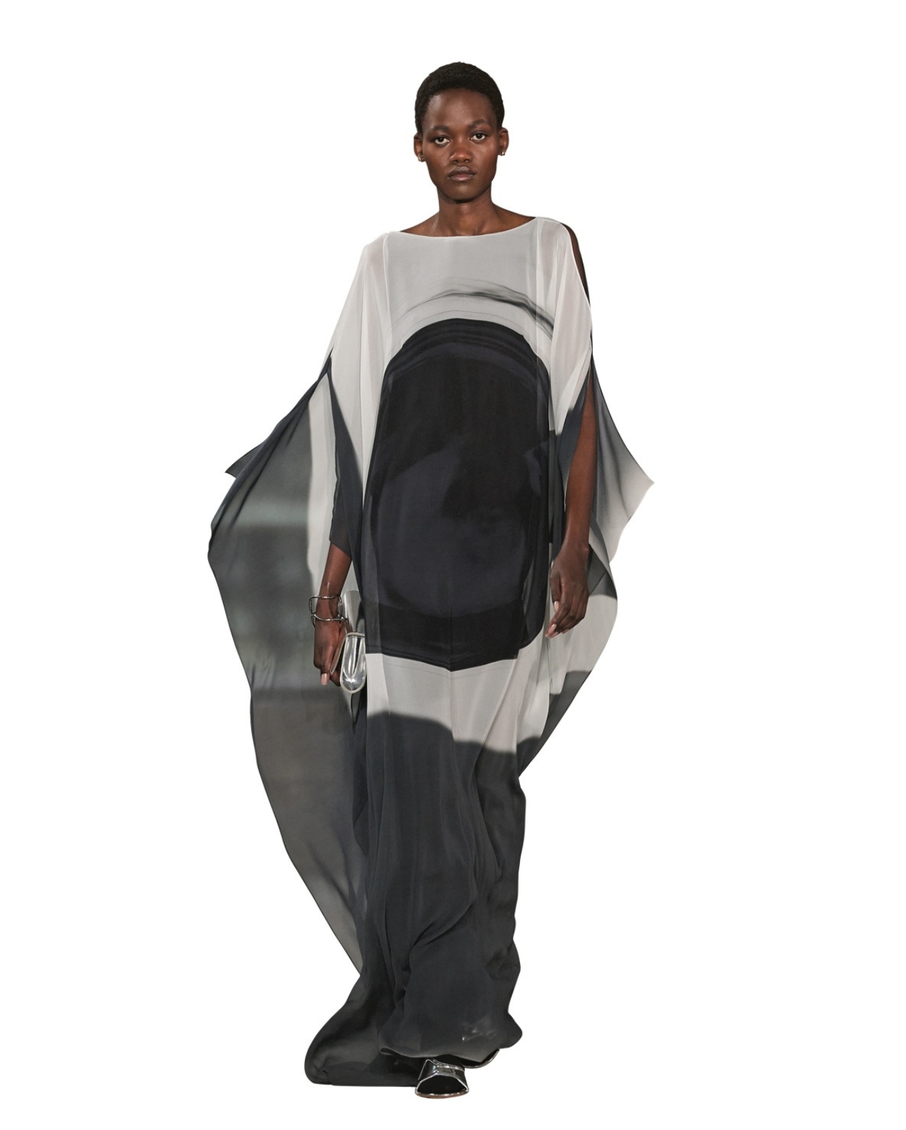 Akris model wearing white and black flowy gown