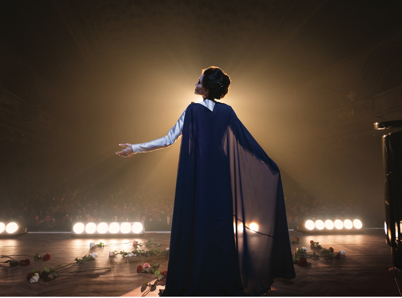 Angelina Jolie wearing a blue gown on stage