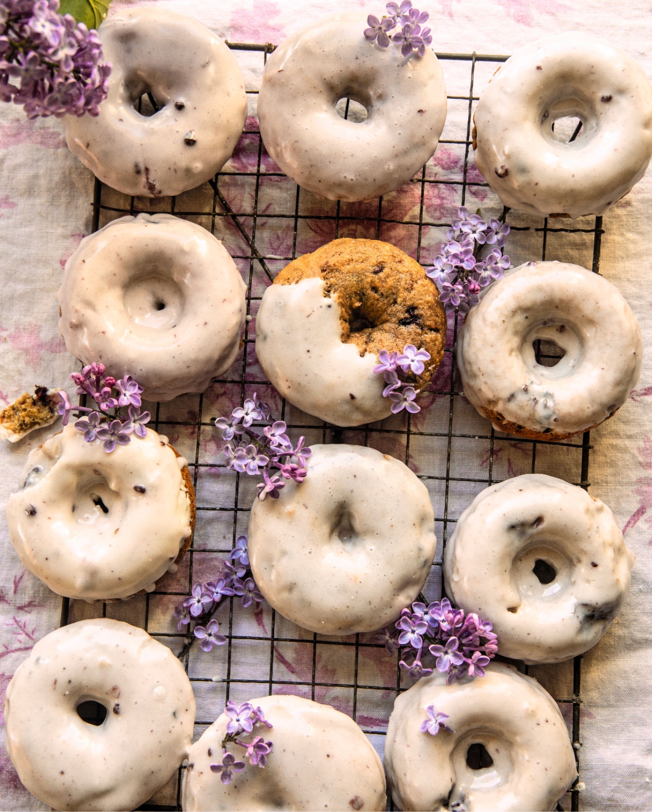 Donuts with glaze and purple flowers