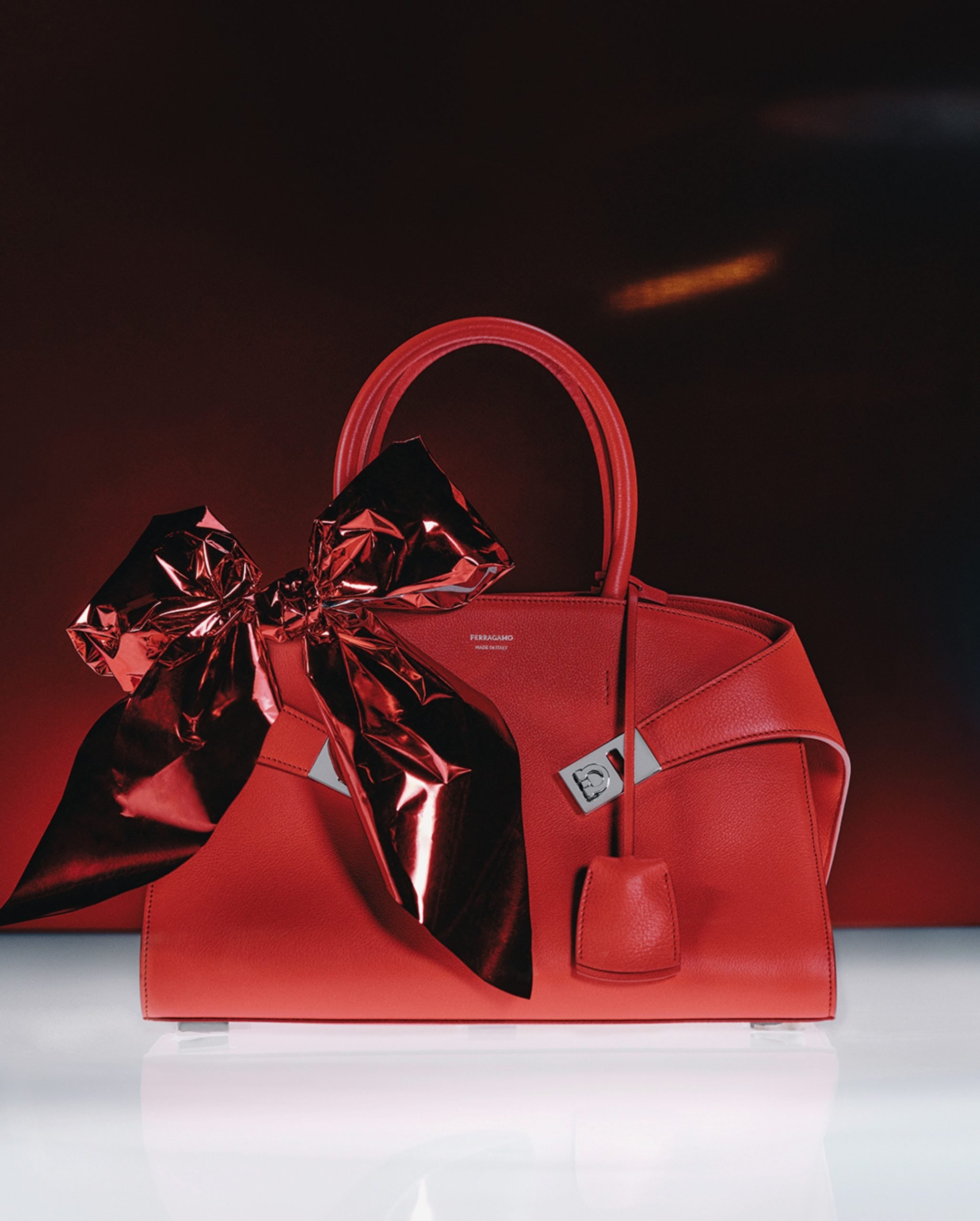 Ferragamo hug handbag in red with a red bow