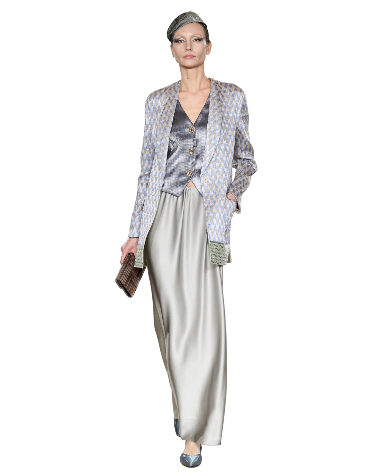 Armani Model wearing silver metallic pant suit with cap and holding a clutch