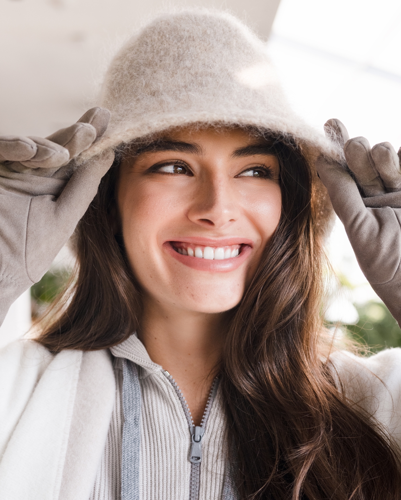 Model wearing a full brunello Cucinelli look with a bucket hat