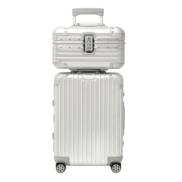 Rimowa silver aluminum suitcase stacked with another case