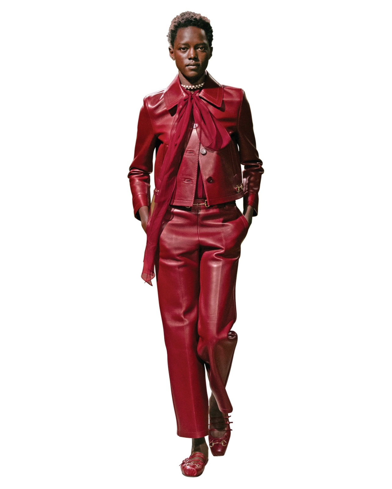 Gucci Model wearing a burgundy leather pant suit