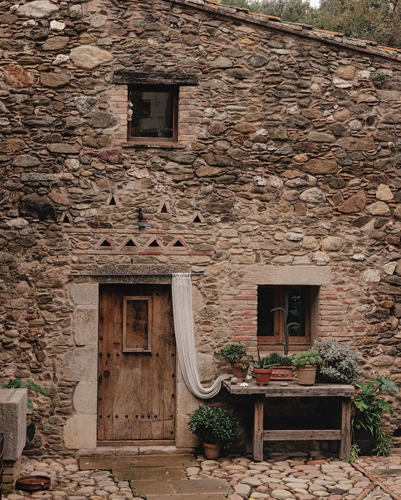 Brickstone house facade with wooden door