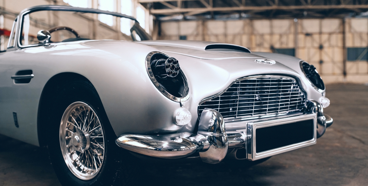 The front of a silver Aston Martin