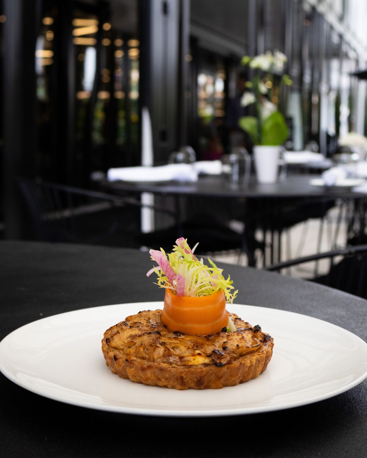 Plate with caramelized onion & goat cheese tart from The Whitman restaurant