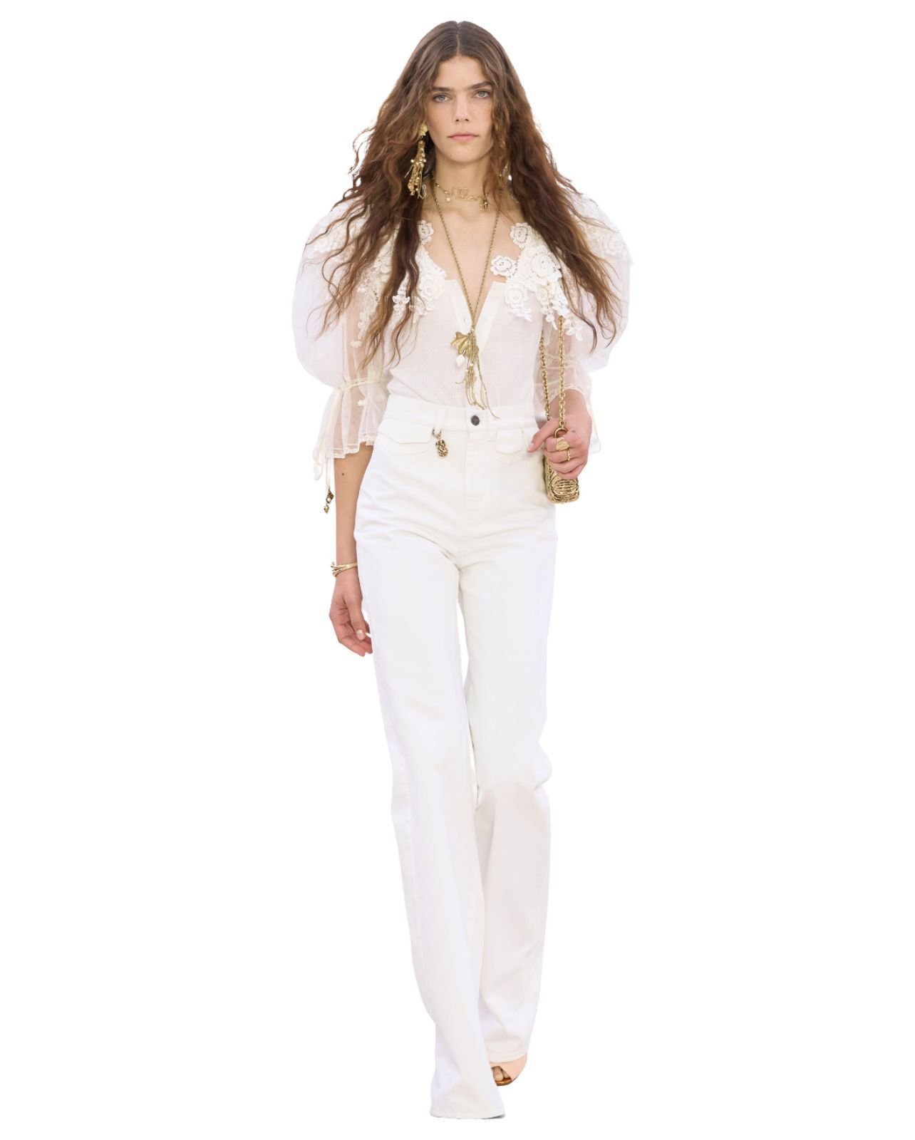 Chloe model wearing an all white outfit with gold jewelry