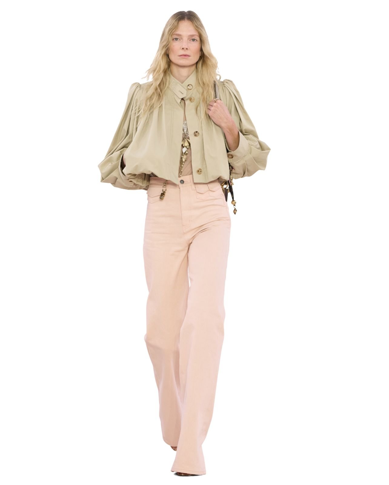 Chloe model wearing a nude puff cropped jacket with light pink pants